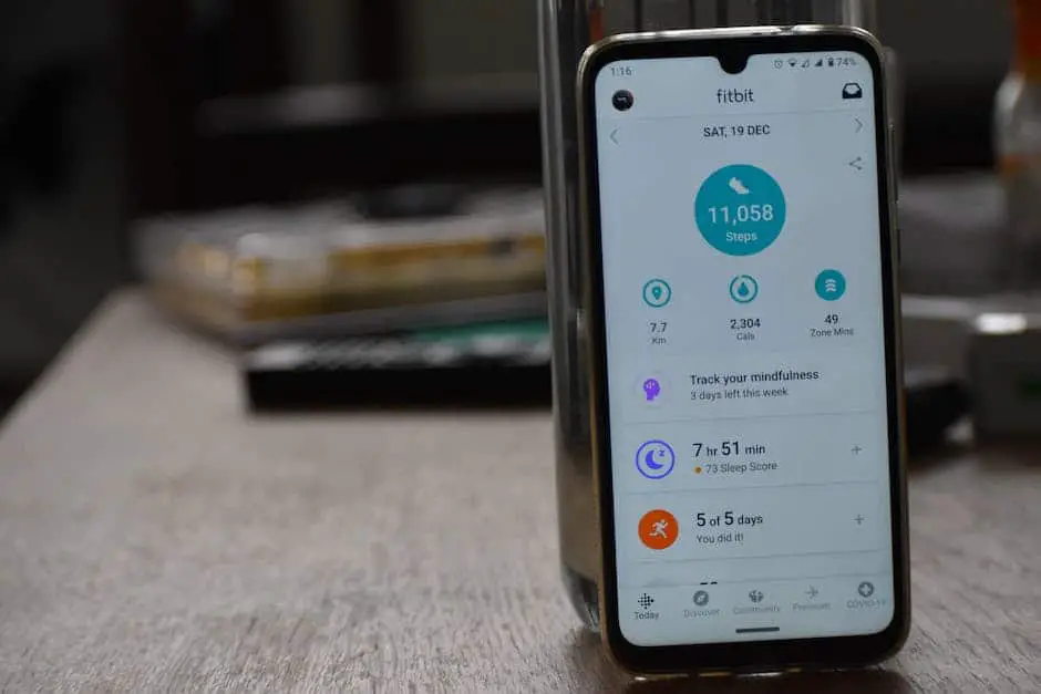 Image of a smartphone with the Samsung Health app open, showing the various tabs and features mentioned in the text.